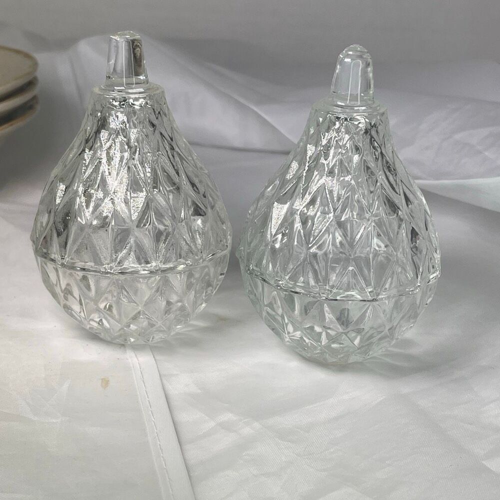 Lot of two lead crystal Romania pear shaped trinket boxes.